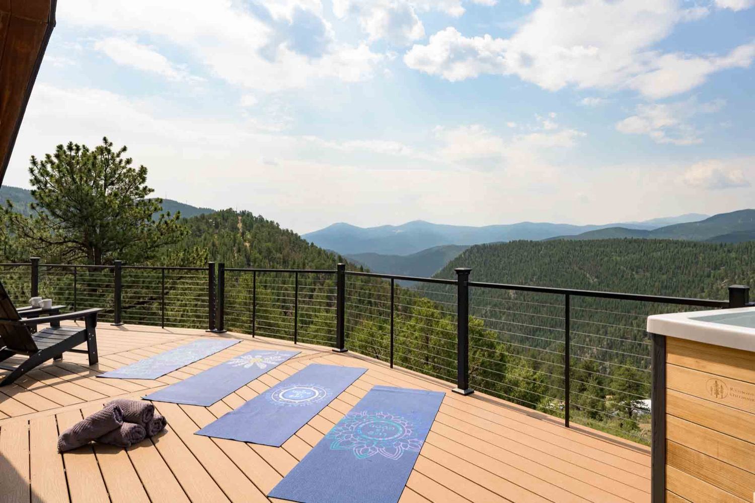 The wraparound deck and hot tub looking out over the Colorado mountains